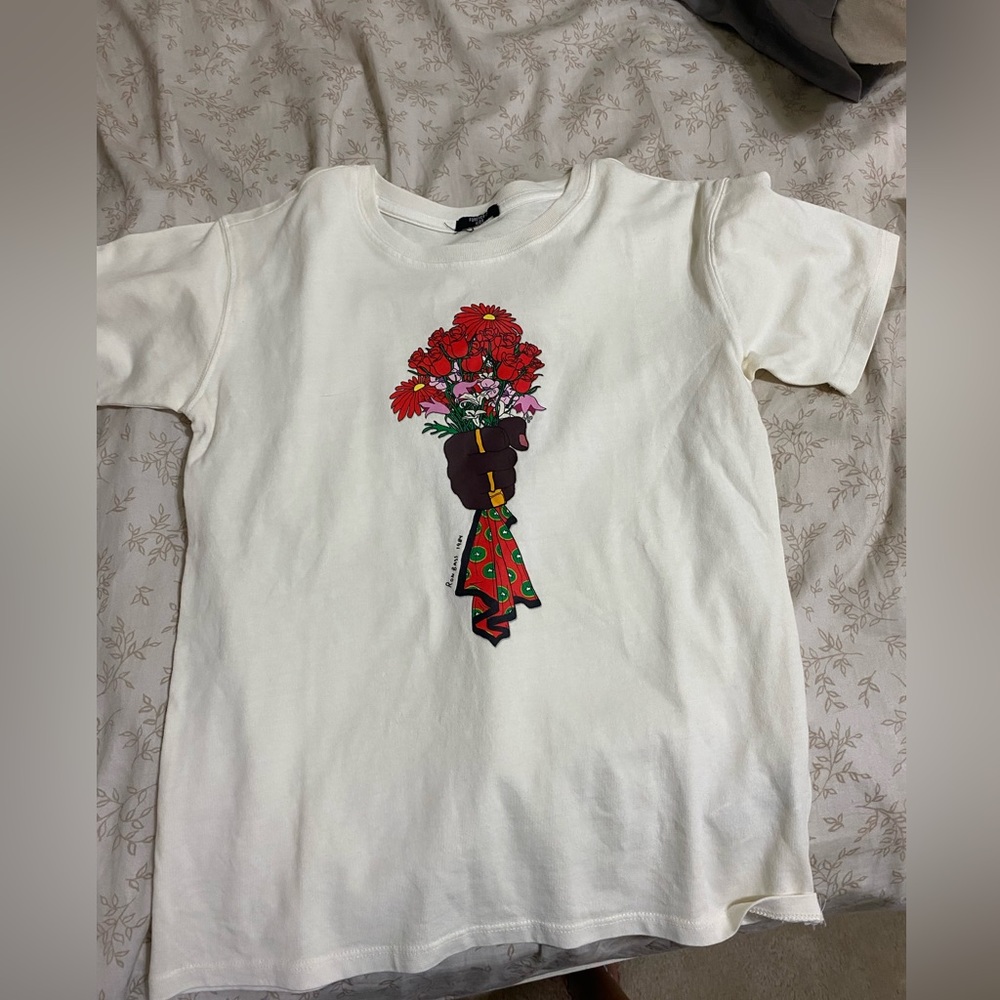 white tshirt with fliers and saying